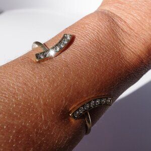 Women`s gold tone cuff bracelet crystal accents.